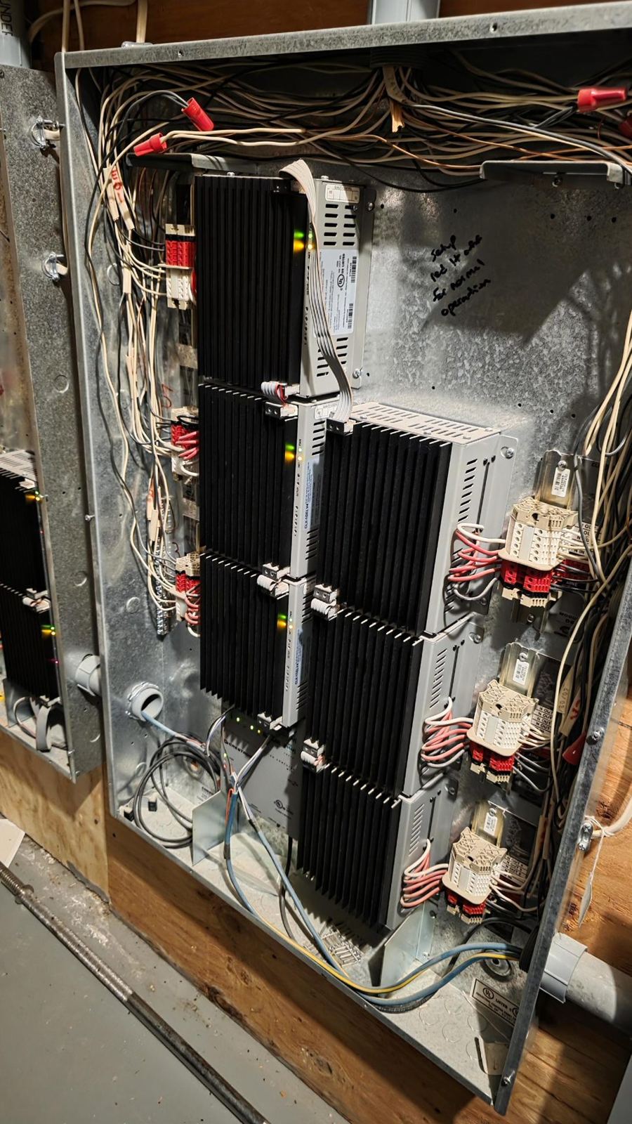 Lighting control dimming panel wired inside an enclosure