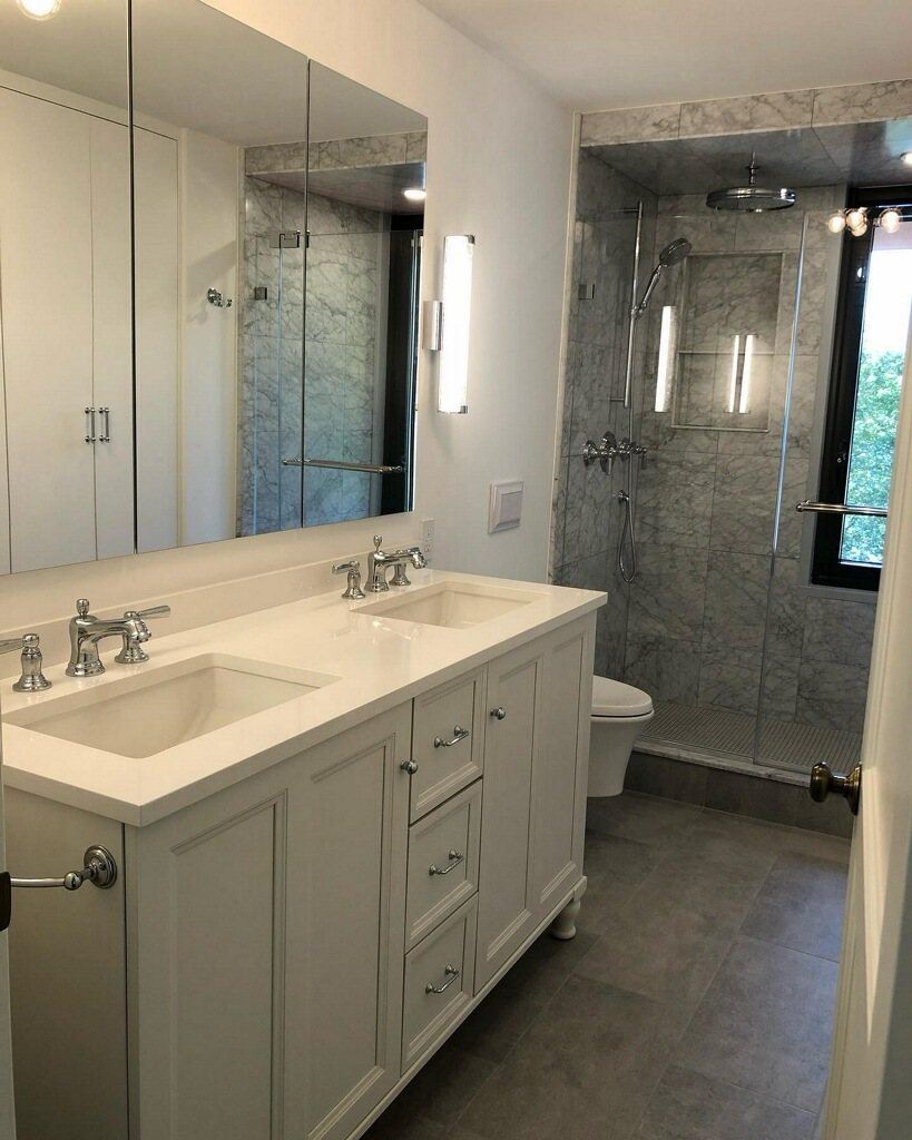 Primary bath with double vanity and marble walk-in shower