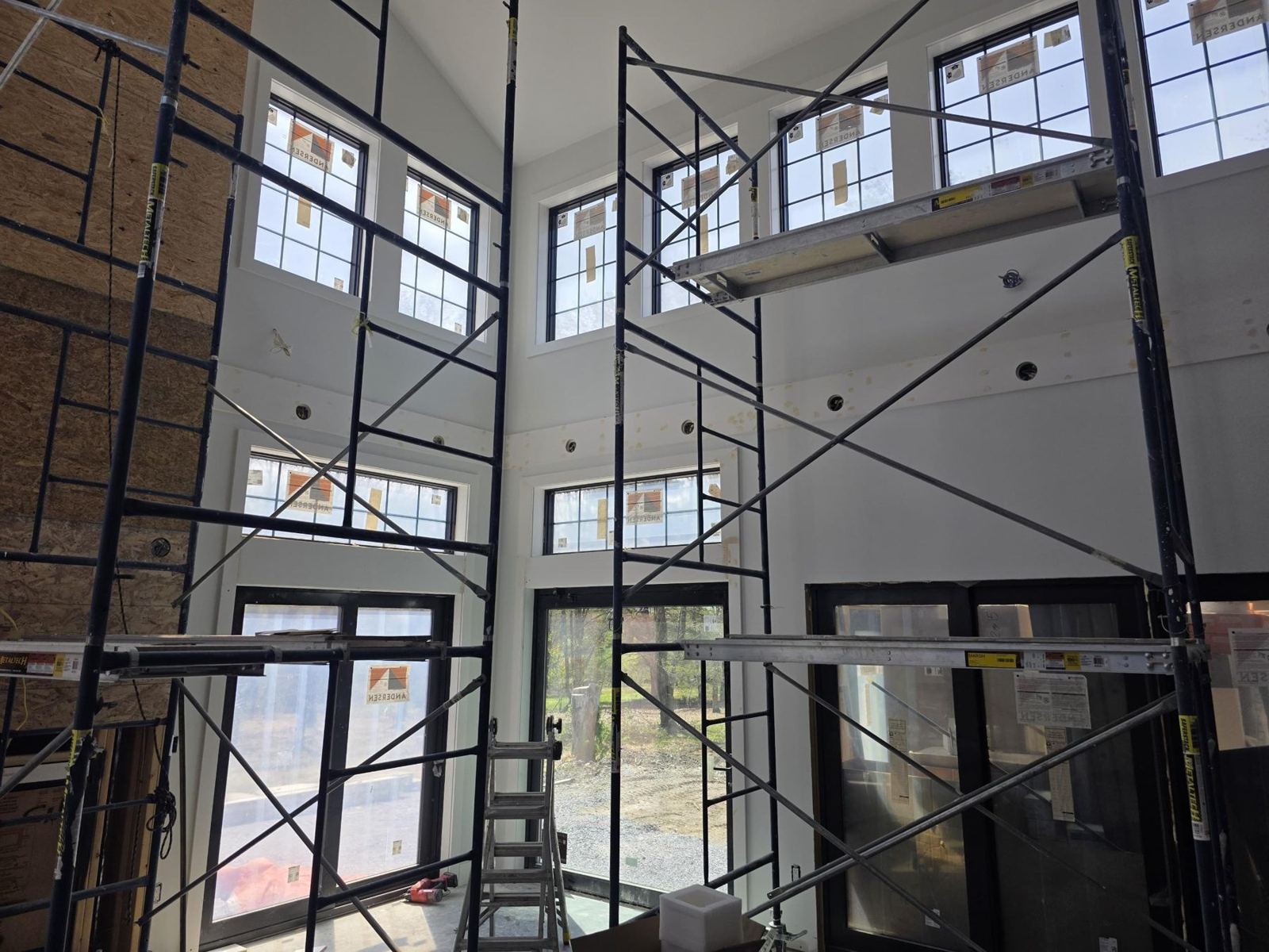 Scaffolding in a vaulted room for drywall and ceiling work